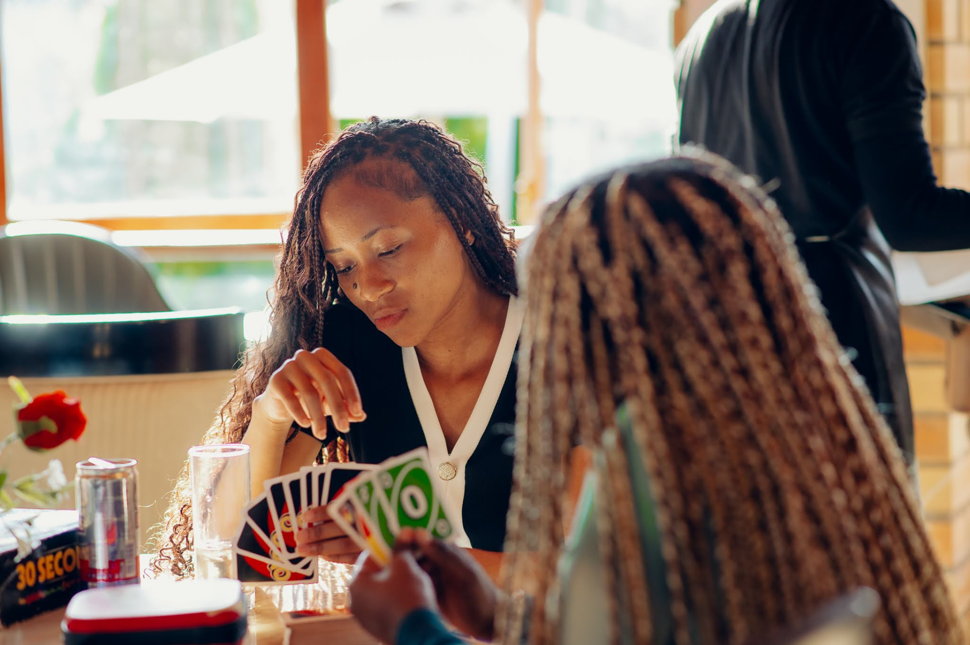 A lively game of Uno at the cafe tables